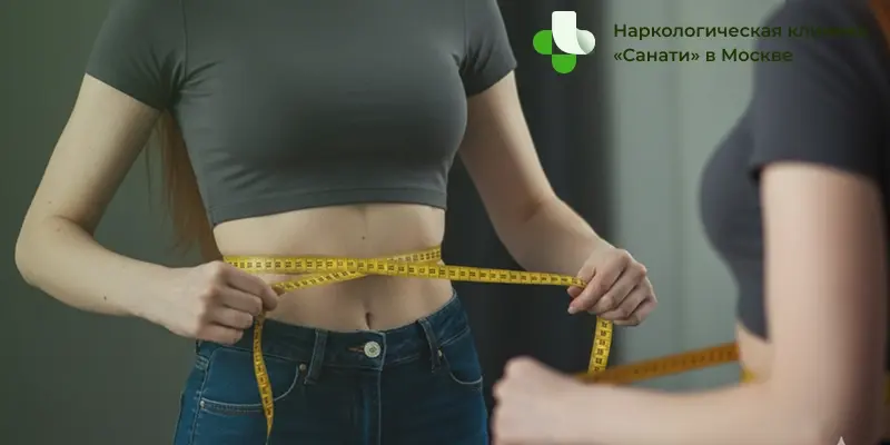 Девушка измеряет талию